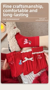 Detailed view of red cotton socks with cute bows, lace edges, and pony embroidery