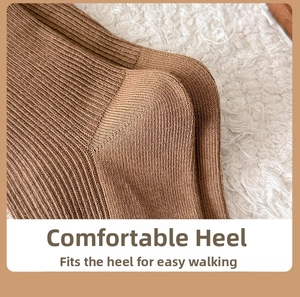 Detail of the reinforced heel on brown knitted cotton socks with fine ribbed texture