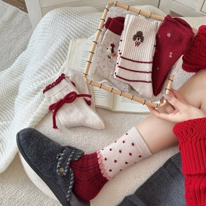 Red wool socks for women with cute cartoon dog embroidery and bow accents in warm knit