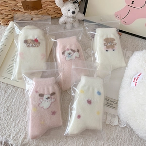 Five-pack of pink and white plush puppy socks in warm fleece with cute cartoon patterns