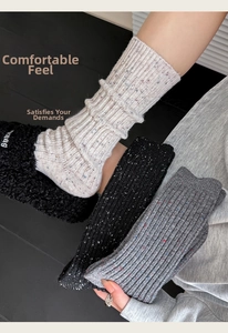 Detail of wool blend thermal crew socks with colorful flecks and ribbed texture
