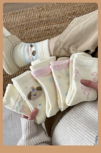 Detailed view of thick cartoon dog crew socks in soft fleece for winter warmth