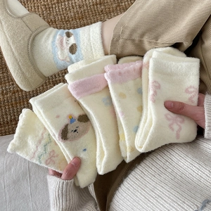 Thick fuzzy thermal socks featuring cute cartoon dog patterns and soft coral fleece material