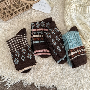 Set of four vintage thermal wool socks for women featuring floral and checkered patterns