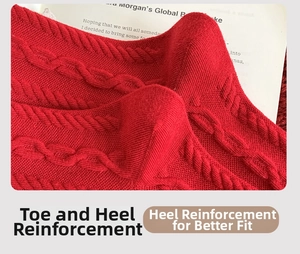 Detailed macro shot of reinforced heel design on red cable knit festive cotton socks