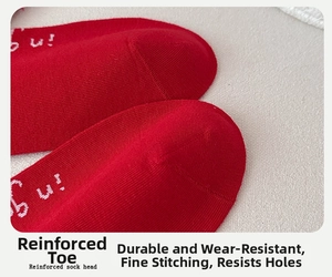 Close-up of reinforced sock toe featuring durable stitching and red cotton knit texture