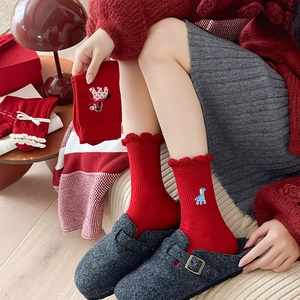 Red mid-calf socks with cute giraffe embroidery and ruffled edges for festive occasions