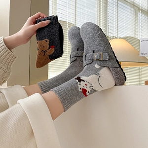 Wool slippers with cartoon animal socks set in cozy home setting with warm lighting