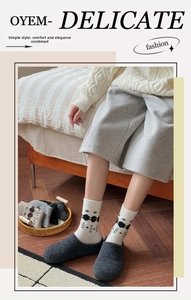 Close-up of thick wool socks with Nordic argyle pattern and vintage snowflake details
