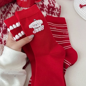 Festive red crew socks with cute puppy embroidery and plush ball accents for winter