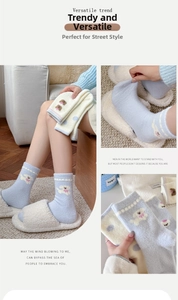 Detailed close-up of thick thermal socks with cute dog pattern and wavy cuffs