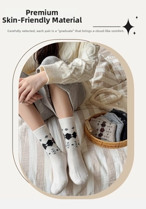 Detailed close-up of vintage argyle wool socks with snowflake patterns and bow accents