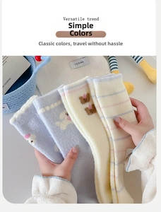 Thick winter plush socks with cartoon dog patterns in pastel blue and cream colors