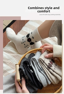 Close-up of thick wool blend socks with vintage argyle pattern in neutral colors