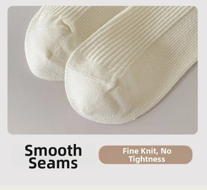 Macro shot of smooth flat-toe seam and fine ribbed knit texture of off-white cotton socks