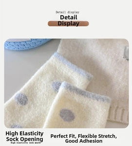 Detail of plush thermal sock cuff with grey polka dots and elastic blue border