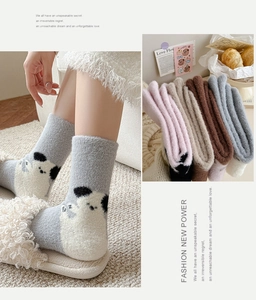 Detailed view of warm coral fleece mid-calf socks with cute cartoon animal patterns