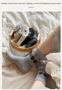Detail of wool socks with vintage argyle pattern in a cozy lifestyle setting