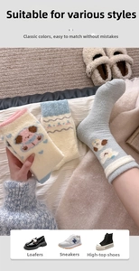 Detail of warm thermal socks with cute knitted puppy pattern and soft textured fabric
