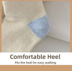 Detailed close-up of thick plush socks with reinforced blue heel and warm fleece texture
