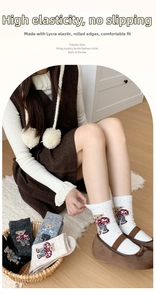 Detail of rolled cuff and cute cartoon bear pattern on thick wool blend socks