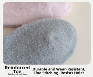 Detail of reinforced toe on thick thermal winter socks showing grey and pink colors