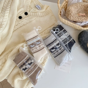 Set di 4 paia di calze di lana nordica da donna con motivi a maglia di renne e fiocchi
