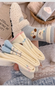 Detailed texture of thickened fleece winter socks with cute cartoon animal patterns