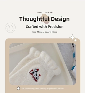 Detail of soft ruffled cuff on cream thermal socks with cute puppy embroidery