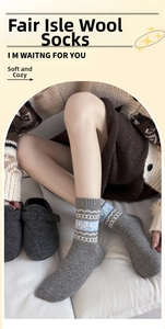 Close-up of Fair Isle wool socks with vintage geometric patterns on a home sofa
