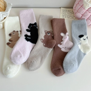 Five pairs of thick winter socks with cute cartoon animal patterns in soft plush fabric