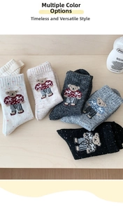 Detailed knit texture of wool socks featuring British style embroidered teddy bear patterns