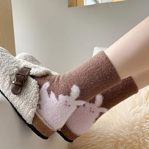 Thick warm wool socks with rabbit pattern and cozy lamb wool slippers for winter comfort
