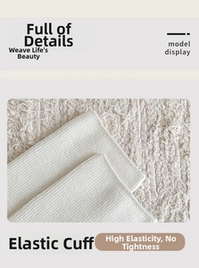 Detail of high-elasticity ribbed cuff on warm cashmere mid-calf socks with seamless texture