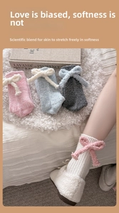 Detailed knit texture and plush bow accent on wool-blend crew socks in various colors