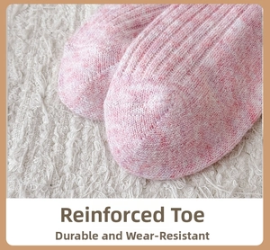 Macro detail of the reinforced toe construction on pink melange wool blend socks