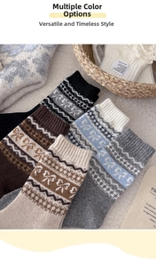 Macro detail of wool knit socks showing bow patterns and vintage Fair Isle textures