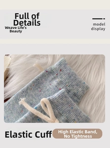 Detail of light blue speckled wool socks with high-elastic cuffs and drawstring bow tie