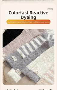 Detail of coral fleece socks featuring cute bear patches and striped warm knit texture