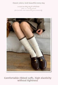 Detail of wool calf socks with contrasting cuffs styled with brown loafers in vintage style