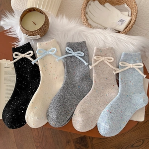 Five-pack set of thick wool socks with colorful flecked texture and cute ankle bows