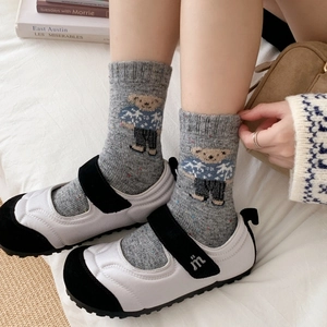 Thick wool socks with cute bear pattern and colorful dots shown in Mary Jane shoes