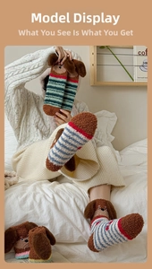 Detailed view of plush dachshund socks with cute 3D ears and striped coral fleece texture