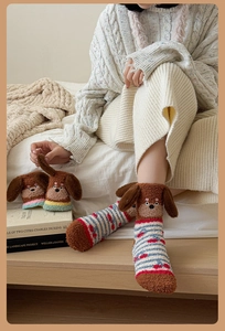 Detail of 3D dog head ear decoration on thick coral fleece striped winter socks
