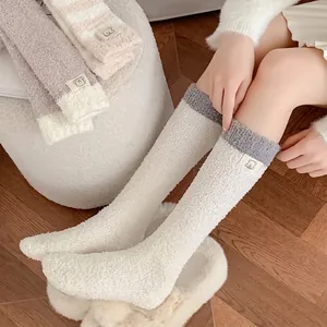 Thick coral fleece mid-calf socks with bear patch and striped detail for winter warmth