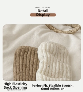Detail of high-stretch rib-knit cuffs on wool socks with colorful nep yarn texture