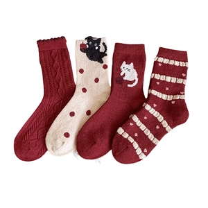 Four pairs of warm wool socks with cute cat patterns and cable knit in red and white