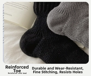 Close-up of thick wool socks showing reinforced toes and cozy knitted texture detail