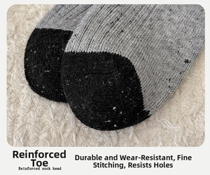 Detail of reinforced sock head with grey and black knit stitching for durability