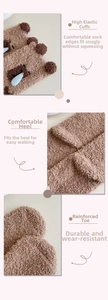 Detail of warm coral fleece socks with plush bear ears, reinforced heel and elastic cuff